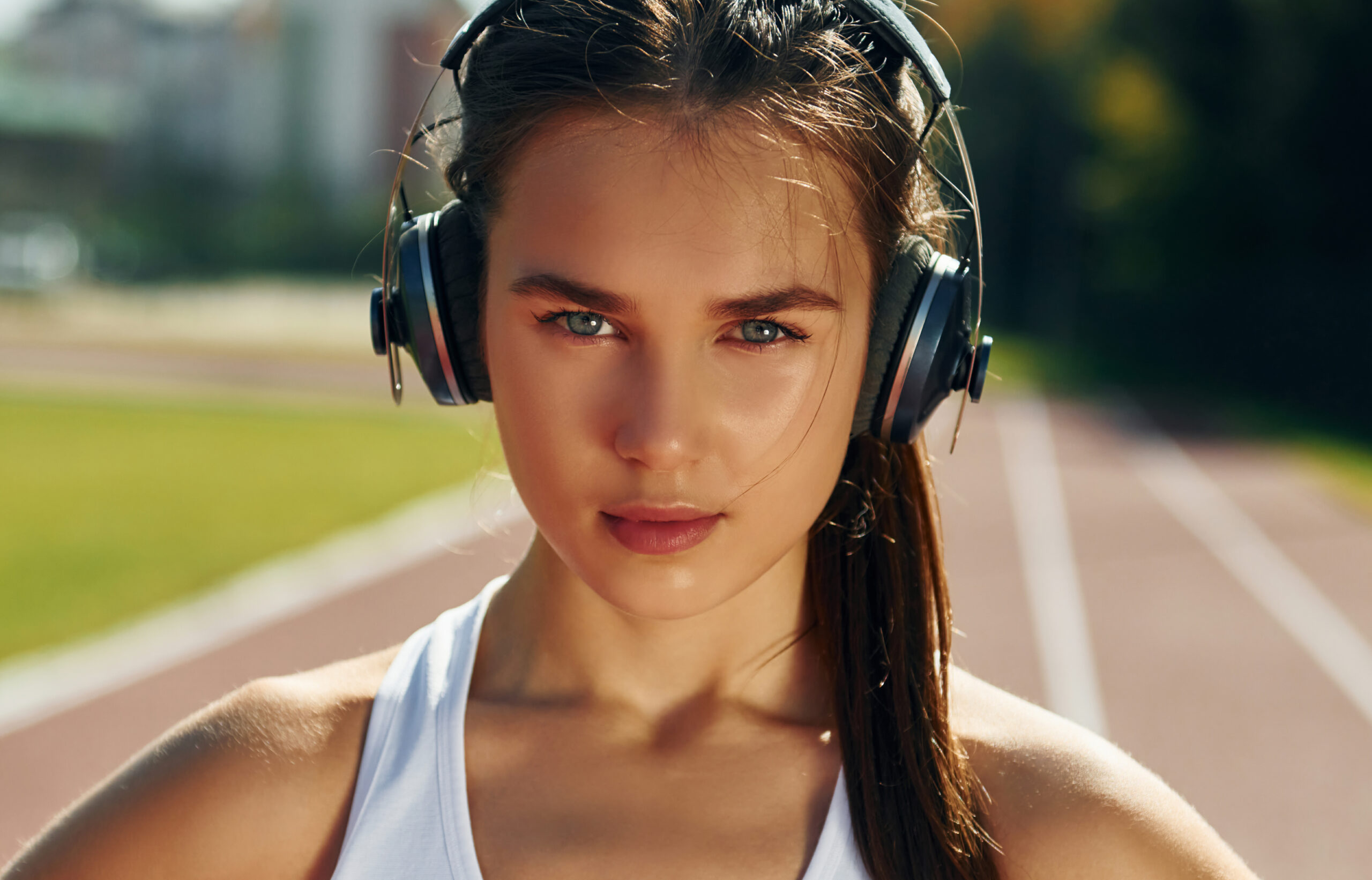 in-headphones-young-woman-in-sportive-clothes